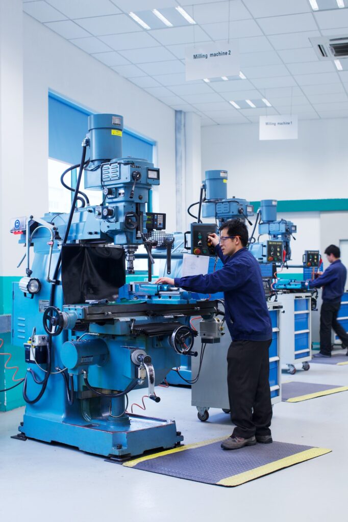 Workers at small parts manufacturing factory in China