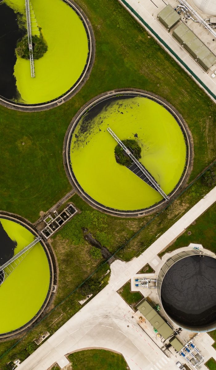 Circular water tanks from above in a water treatment and sewage purification industrial plant